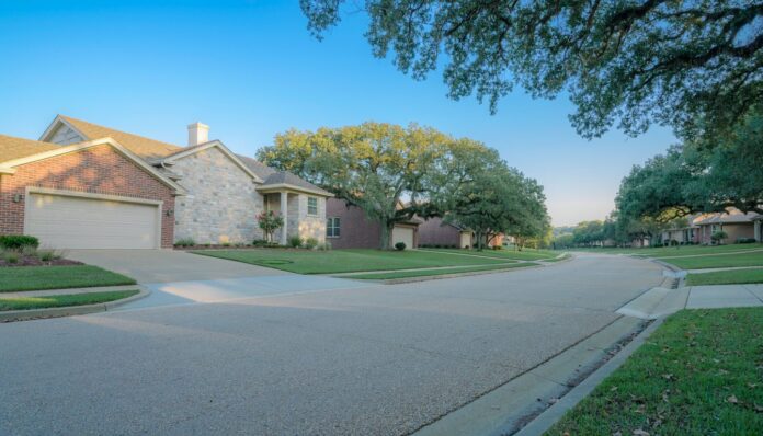 Firefly quiet suburban street in the texas hill country single story limestone and brick hom 632199