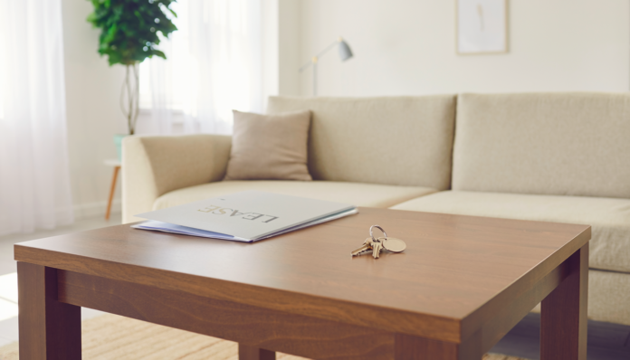 Firefly realistic photo of a bright tidy rental apartment living room with a set of house ke 469804
